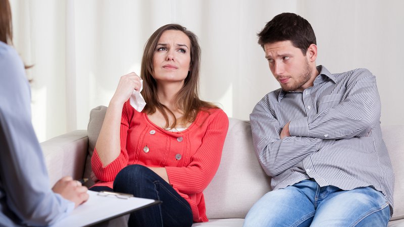 Young unhappy couple on special marriage therapy session
